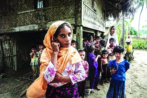 This photo taken on July 13, 2017 shows a Muslim family at Maung Hnama village, Buthidaung township in Myanmar's northern Arakan state. (Image: Kuwait Times)