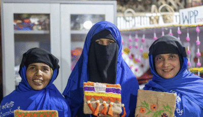 Rohingya women showing their products made during participation in WPP (Image: IOM)