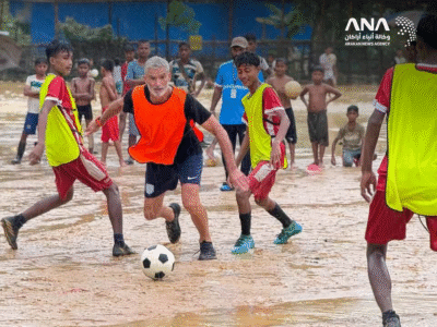 Craig Foster playing football with Rohingya children in Bangladesh camps (Image: ANA)